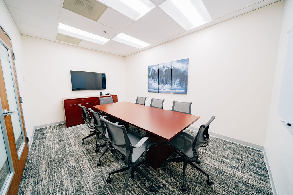 Interior photo of fully equipped conference room for Lake Grove Crossing Executive Suites